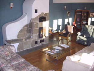 Masonry heater in common living room